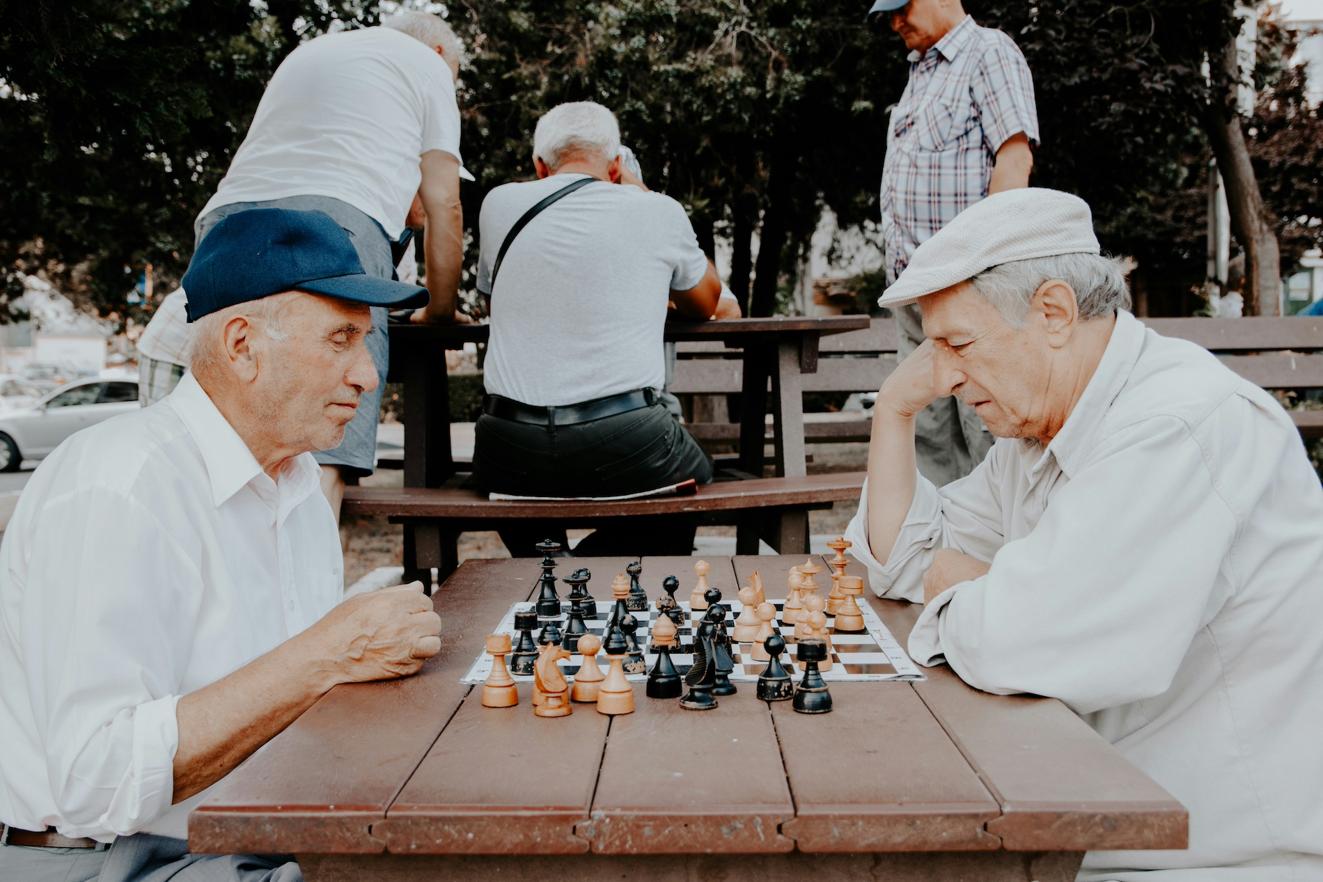 Two men in older age playing chess